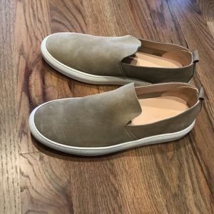 Size 12, tan Astroflex slip-ons.